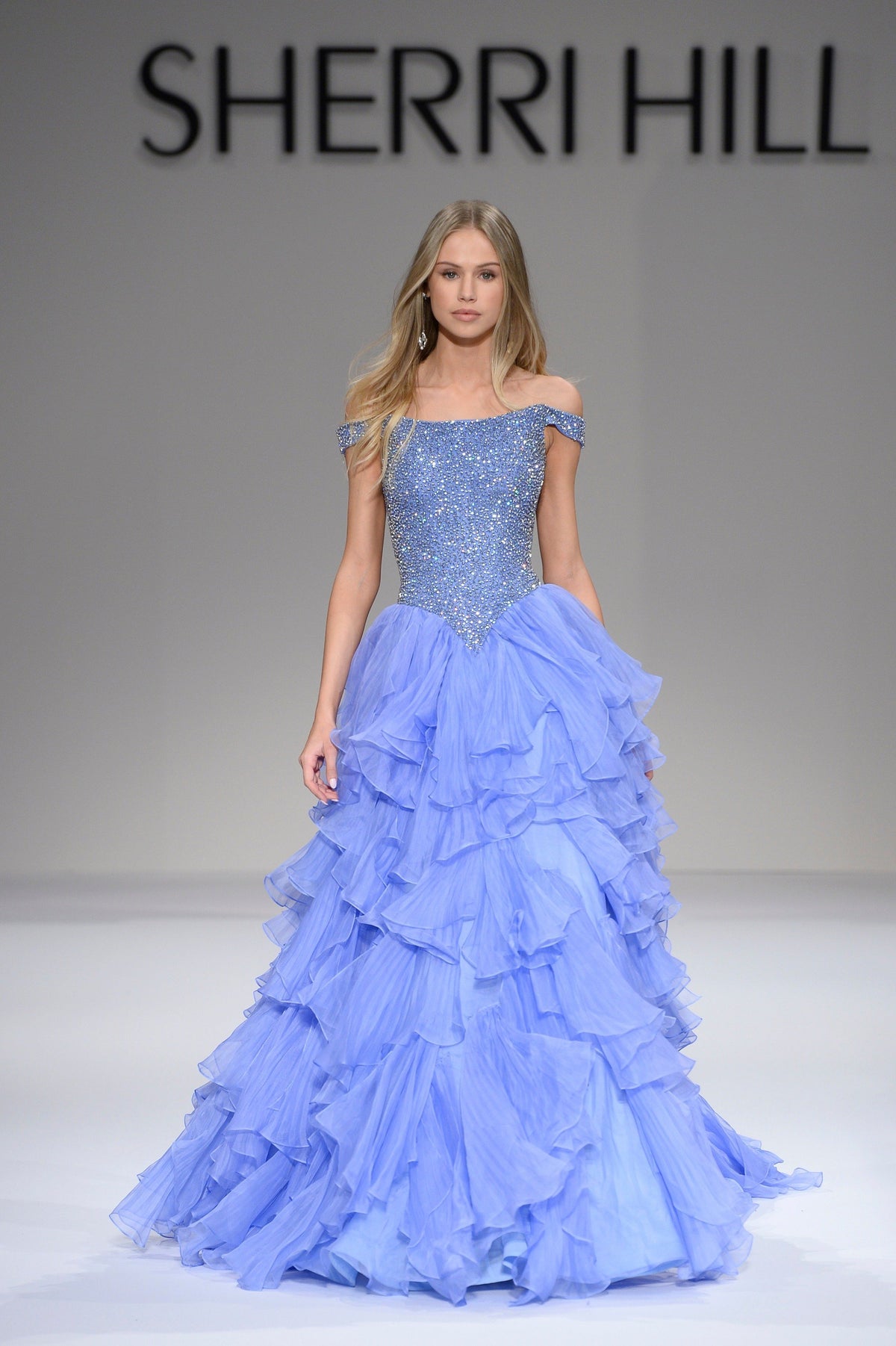 Sherri Hill 44570 off-the-shoulder ruffled ball gown in periwinkle