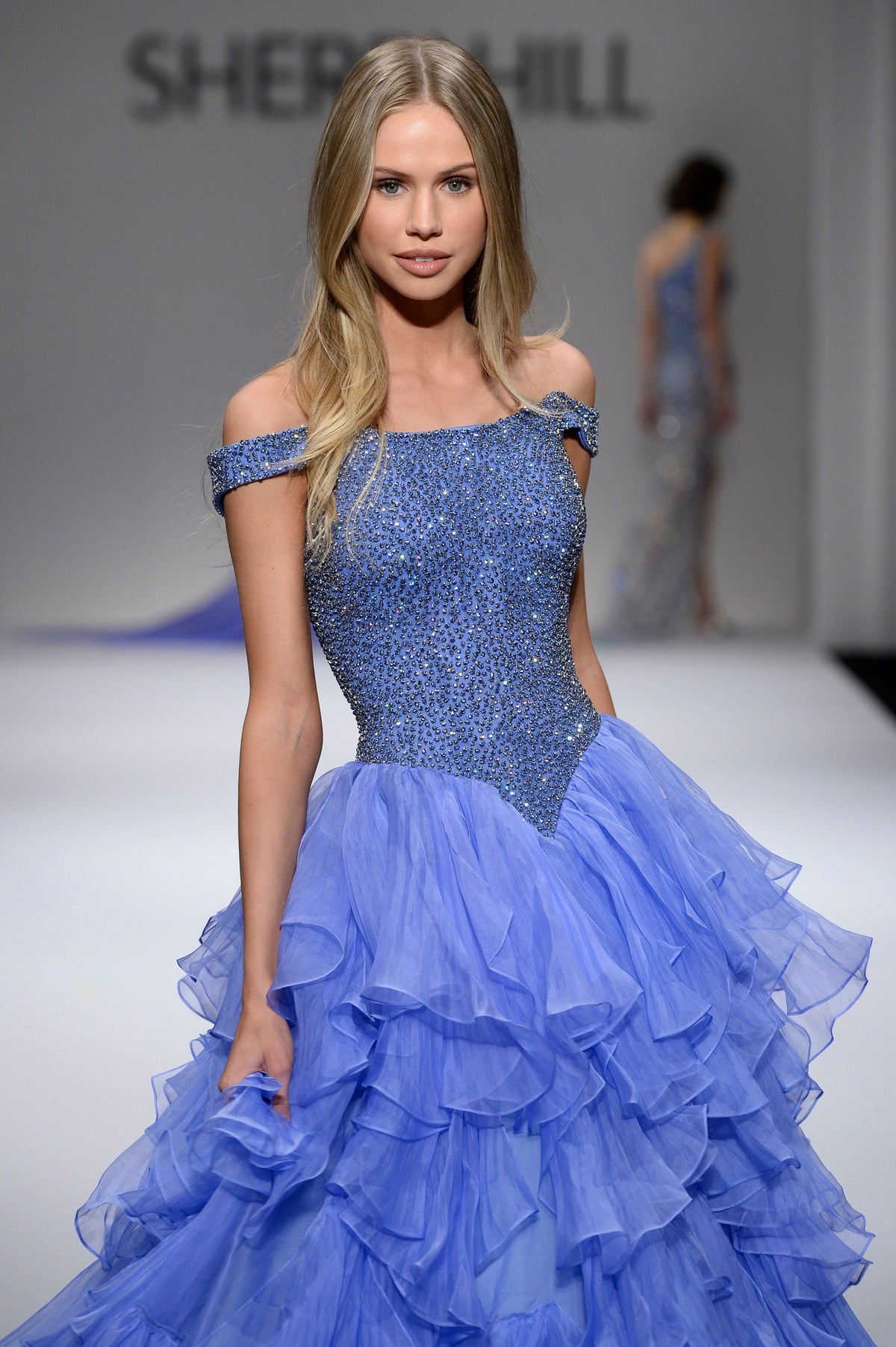 Sherri Hill 44570 off-the-shoulder ruffled ball gown in periwinkle