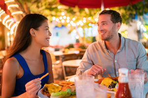 A couple out on date night after thinking about date night outfit ideas.