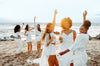 diverse female friends dancing outdoors, All White Party Outfit Ideas