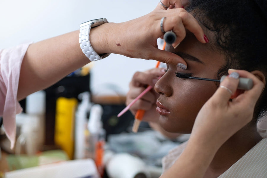 makeup artist is applying mascara to a model, Getting Ready for Prom Checklist