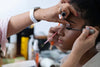 makeup artist is applying mascara to a model, Getting Ready for Prom Checklist