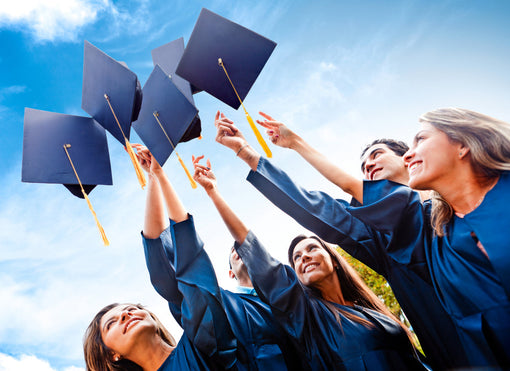 Students throwing graduation hats in the air celebrating, Graduation Outfit Ideas