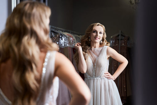blonde girl wearing a full-length silver chiffon prom ball gown, Top 5 Prom Dress Trends
