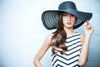 graceful woman in elegant hat with a wide brim, Summer 2025 Fashion Trends