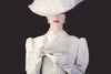 Young redhead woman in white Victorian era clothes with cup of tea, What to Wear to a Tea Party