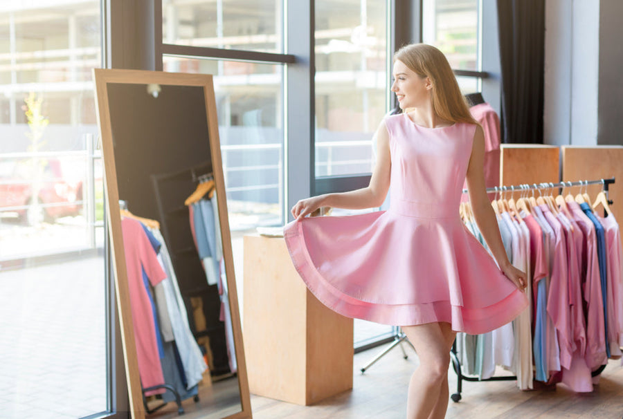 Woman Trying On Pink Dress In Front Of Mirror, Pink Outfit Ideas