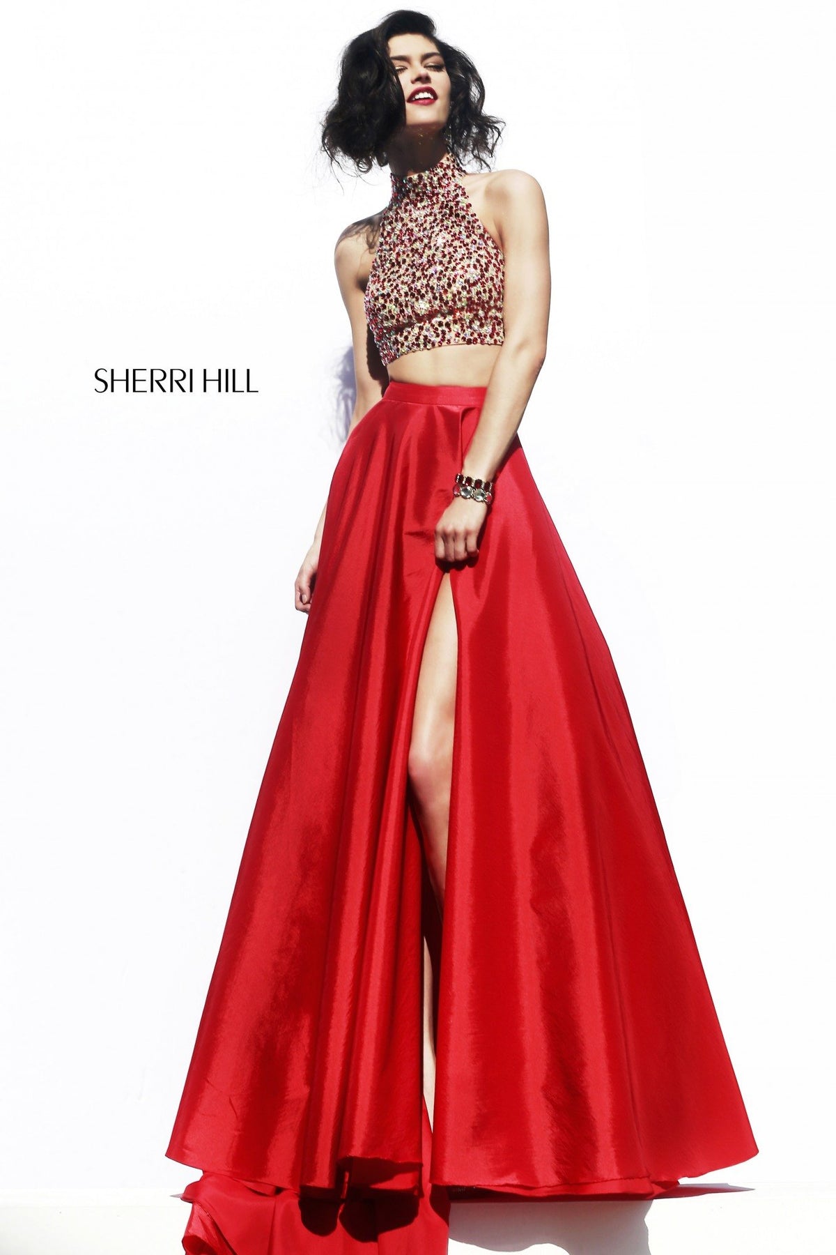 Sherri Hill 32020 two-piece gown with beaded crop top and slit skirt in red