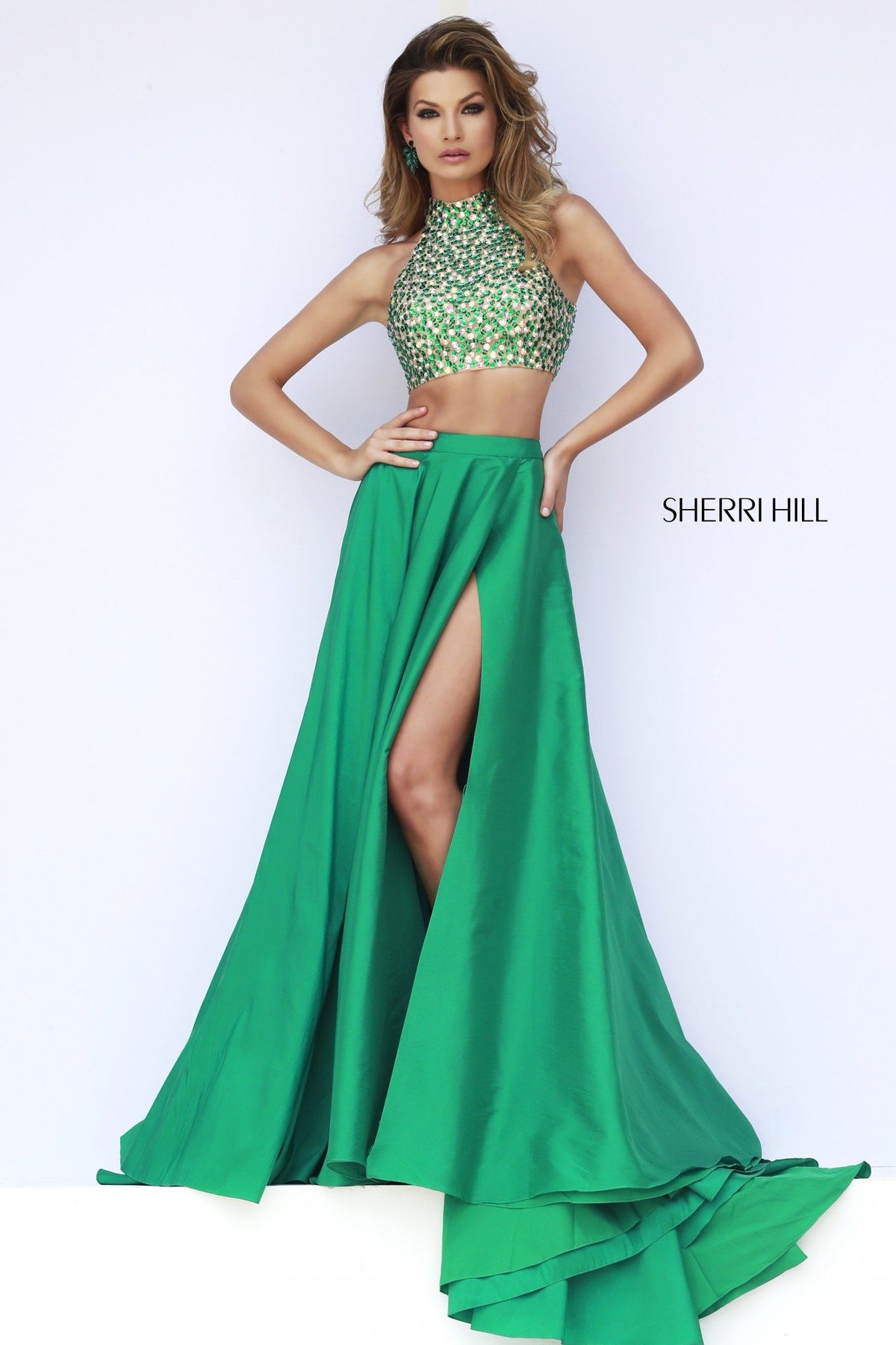 Sherri Hill 32020 two-piece gown with beaded crop top and slit skirt in emerald