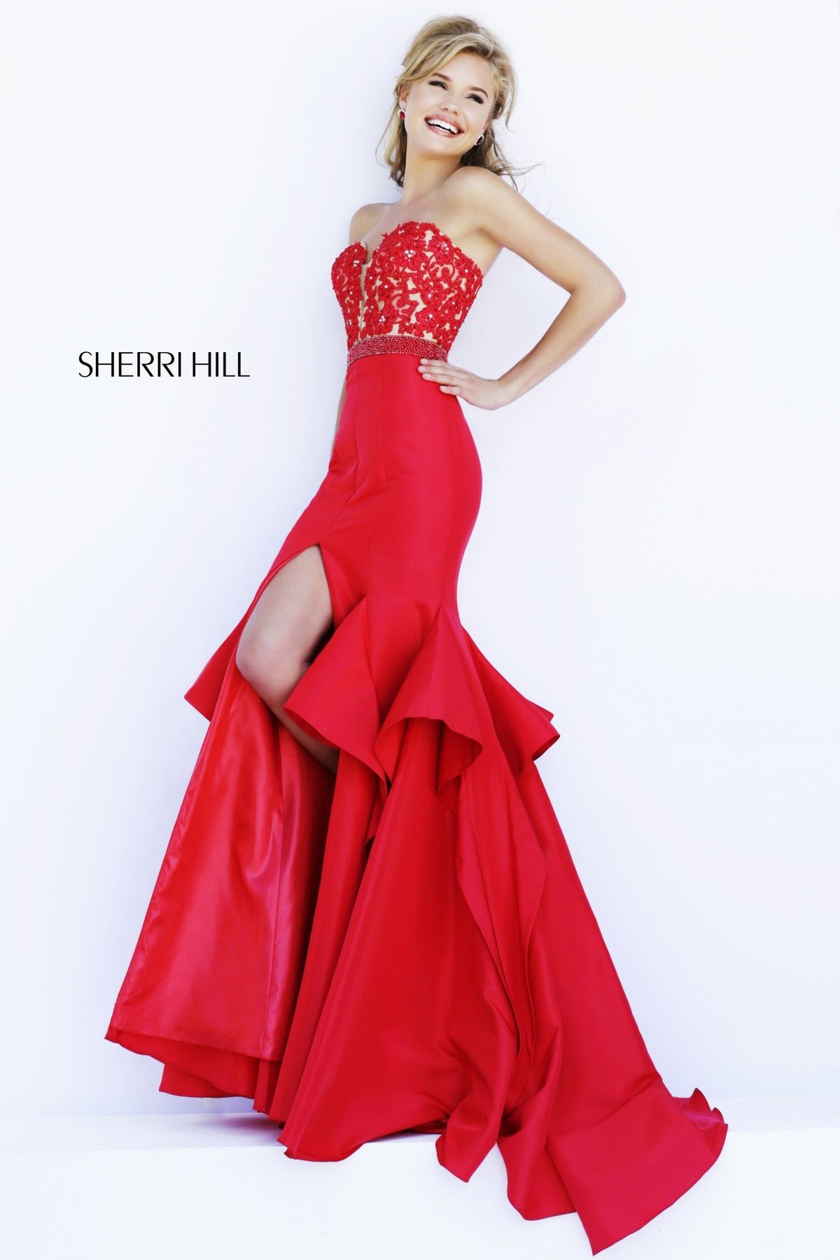 Sherri Hill 32192 strapless satin mermaid gown with ruffled skirt and slit in red