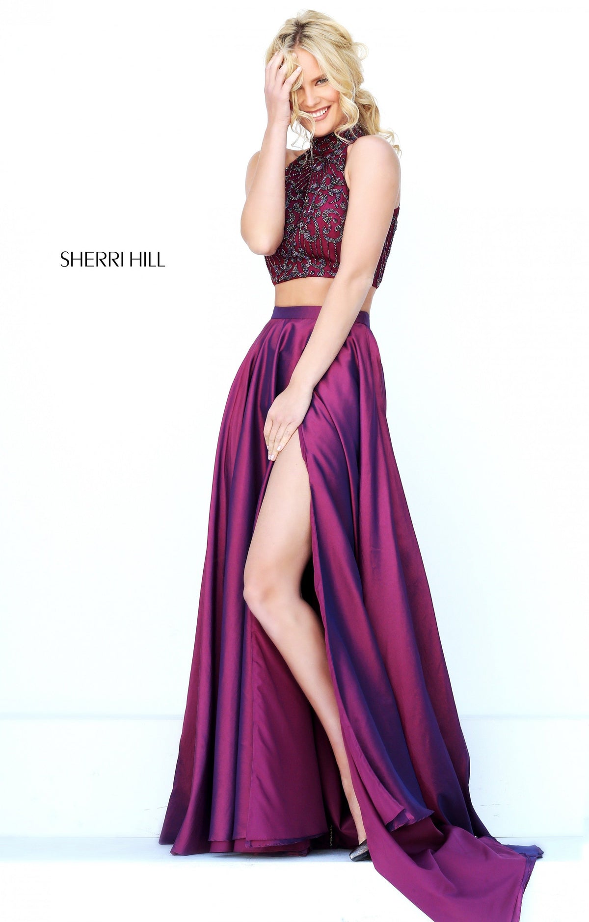 Sherri Hill 50627 two-piece satin gown with beaded crop top and slit in plum