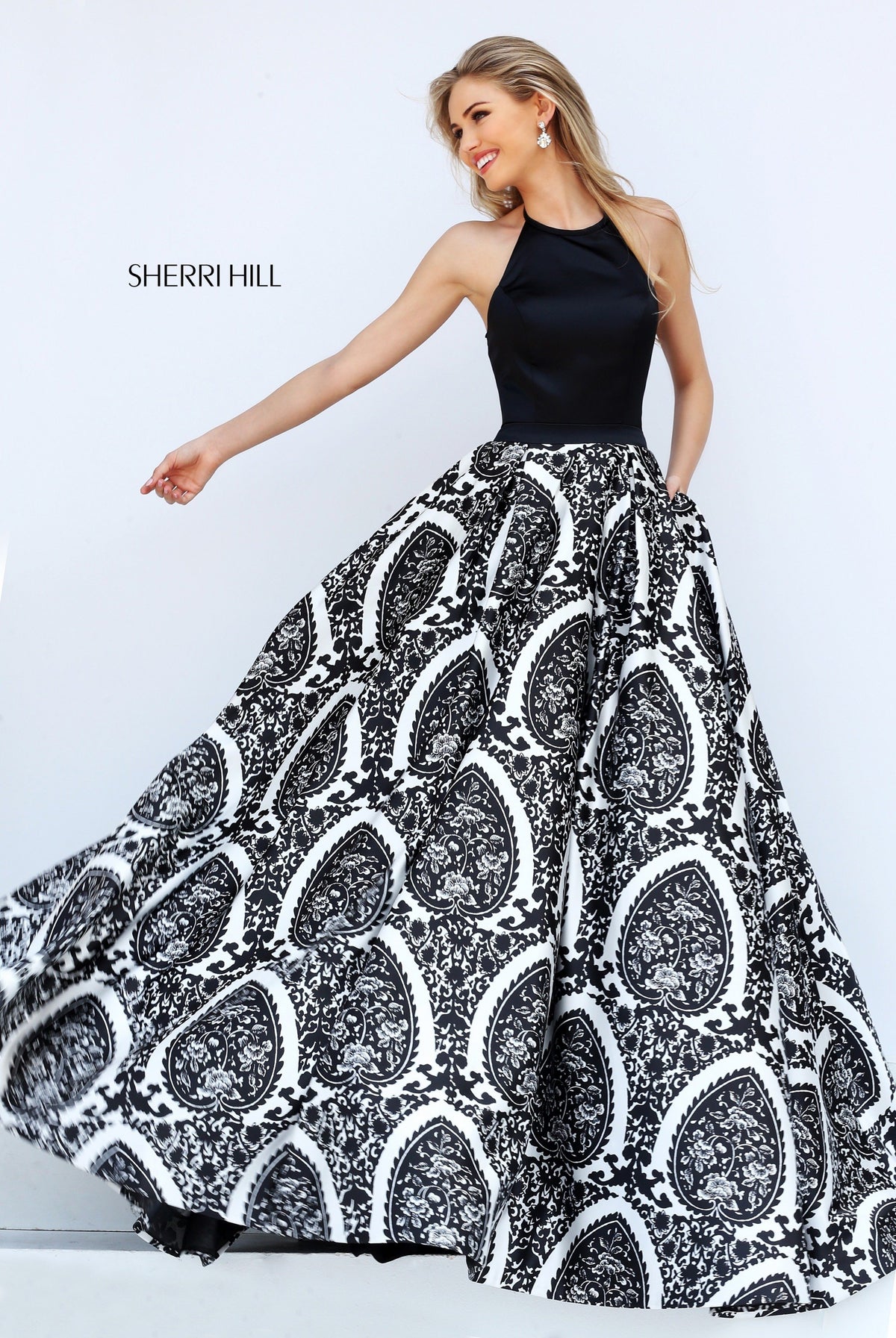 Sherri Hill 50577 two-piece print ball gown with halter top in black/ivory print