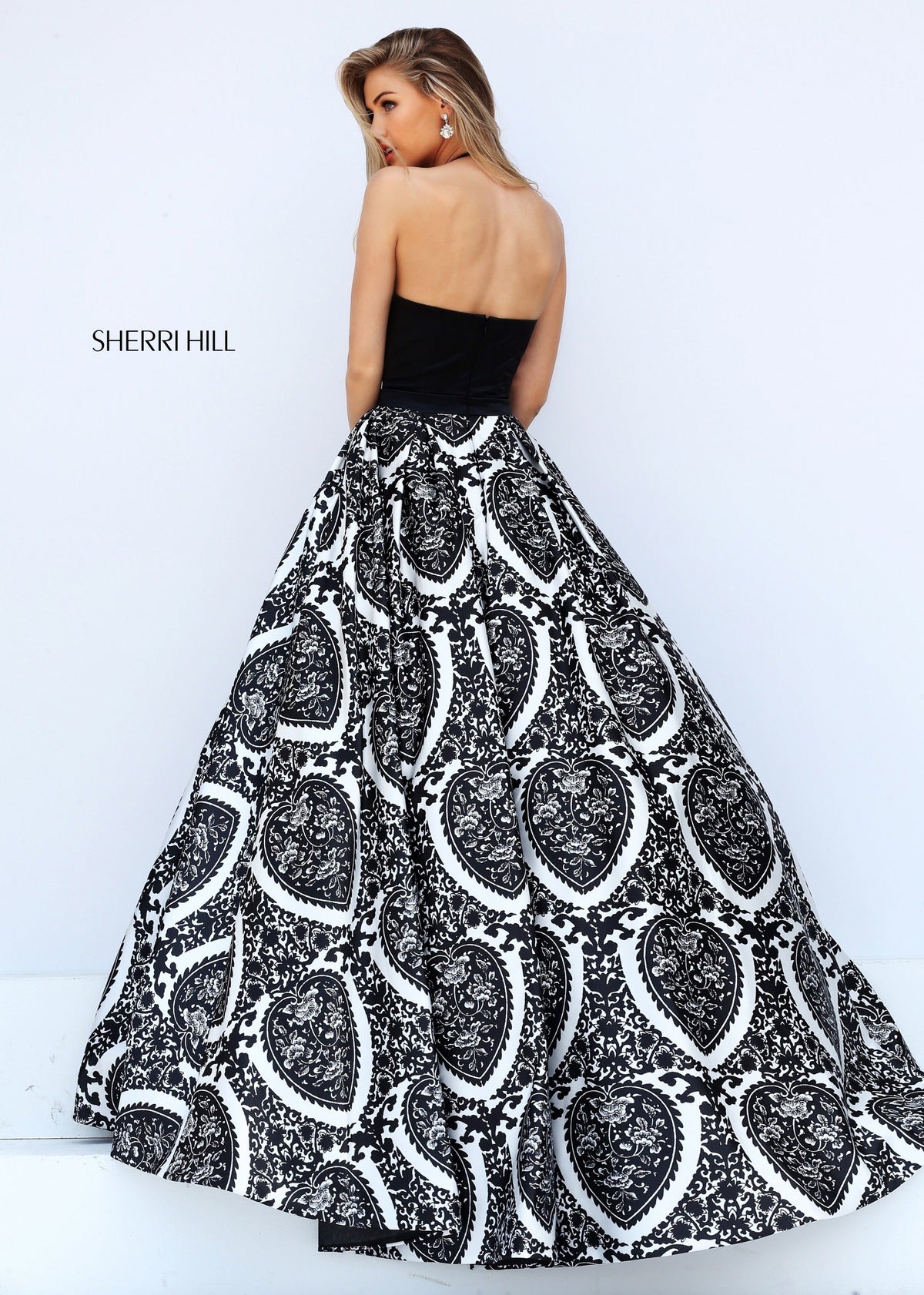 Sherri Hill 50577 two-piece print ball gown with halter top in black/ivory print