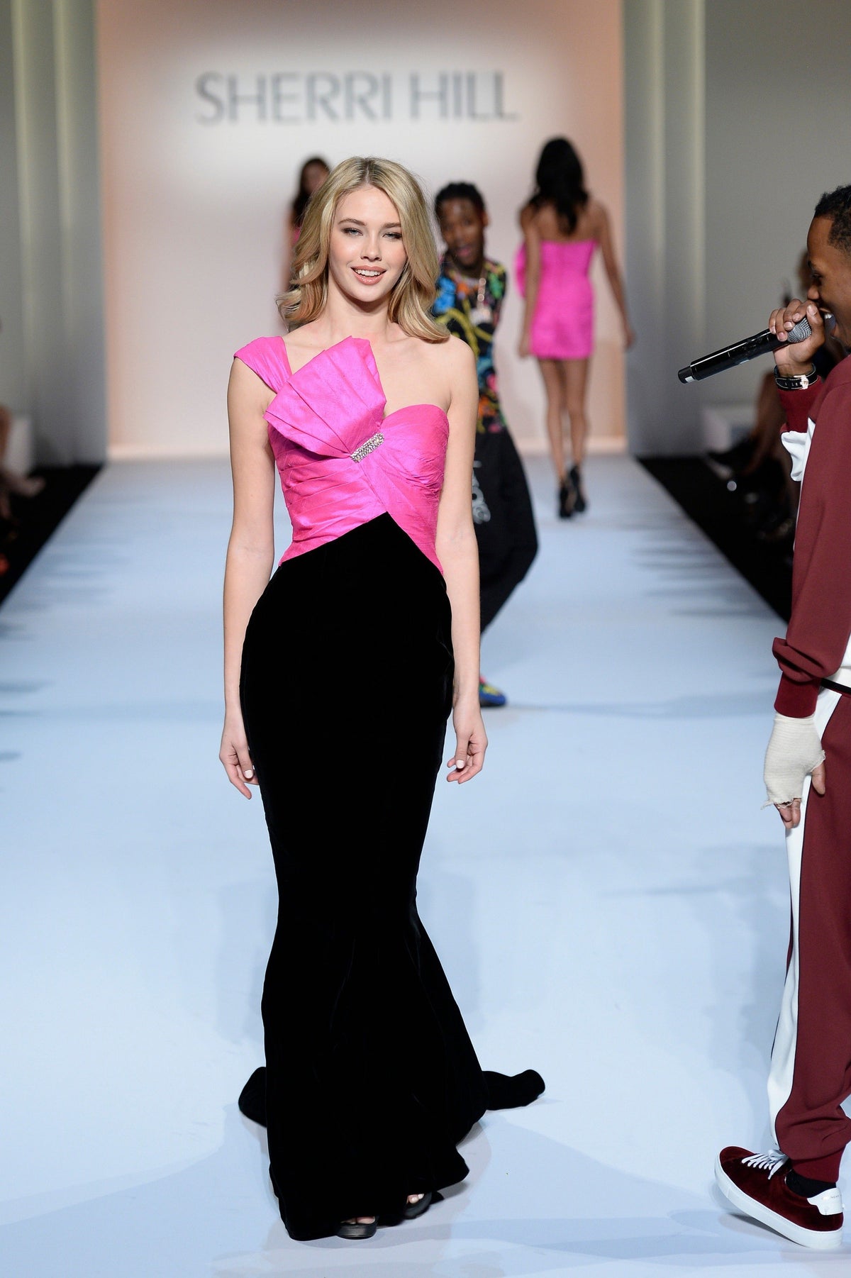 Sherri Hill 44729 velvet mermaid gown with satin bow bodice in fuchsia/black