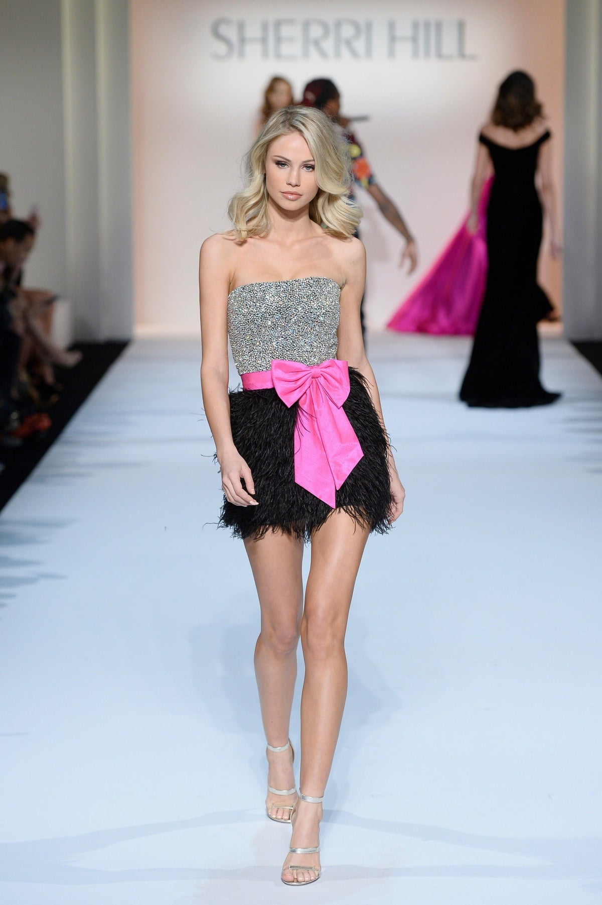Sherri Hill 44798 strapless beaded cocktail dress with feather skirt and bow in black/fuchsia