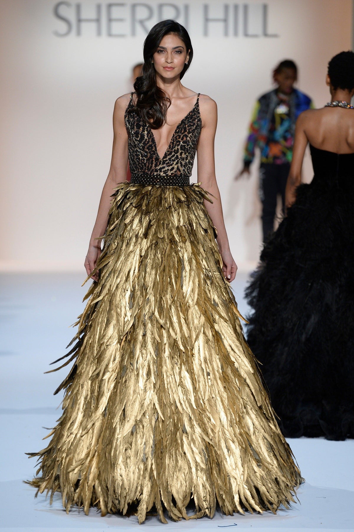 Sherri Hill 44700 V-neck beaded gown with feather skirt in leopard/gold