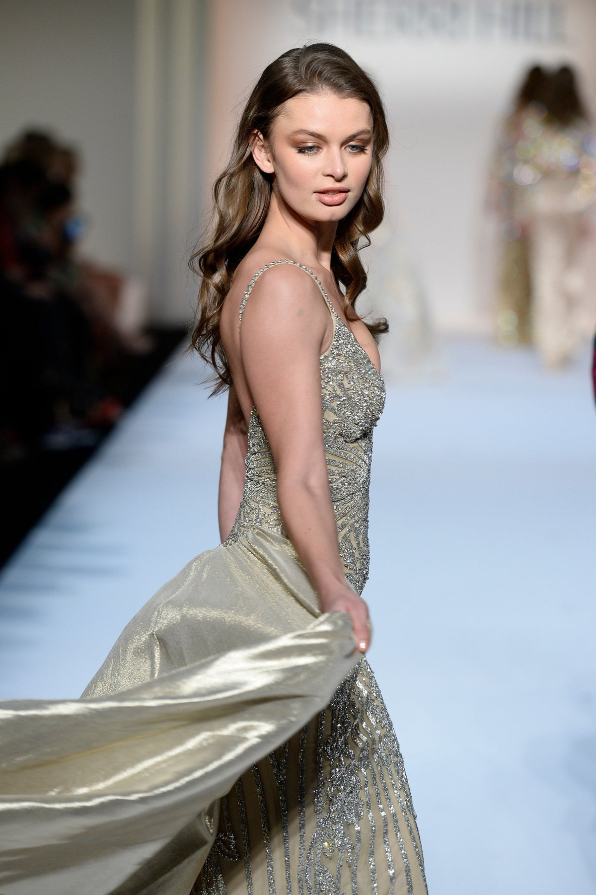 Sherri Hill 44712 beaded fitted gown with metallic overskirt in gold