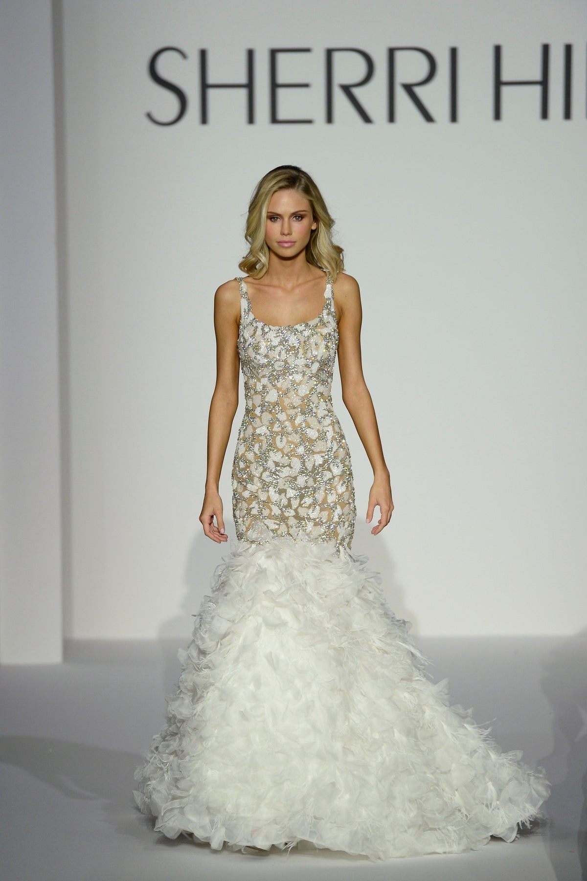 Sherri Hill 44650 beaded mermaid gown with ruffled tulle skirt in ivory/nude