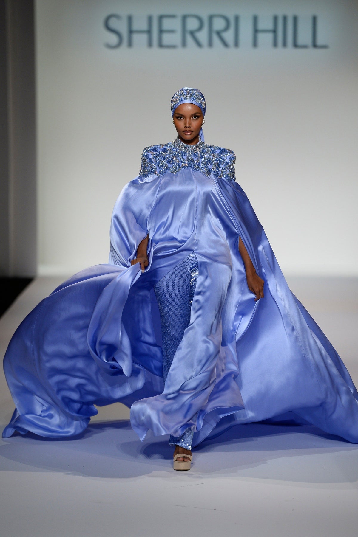 Sherri Hill 44894 satin gown with cape sleeves in periwinkle