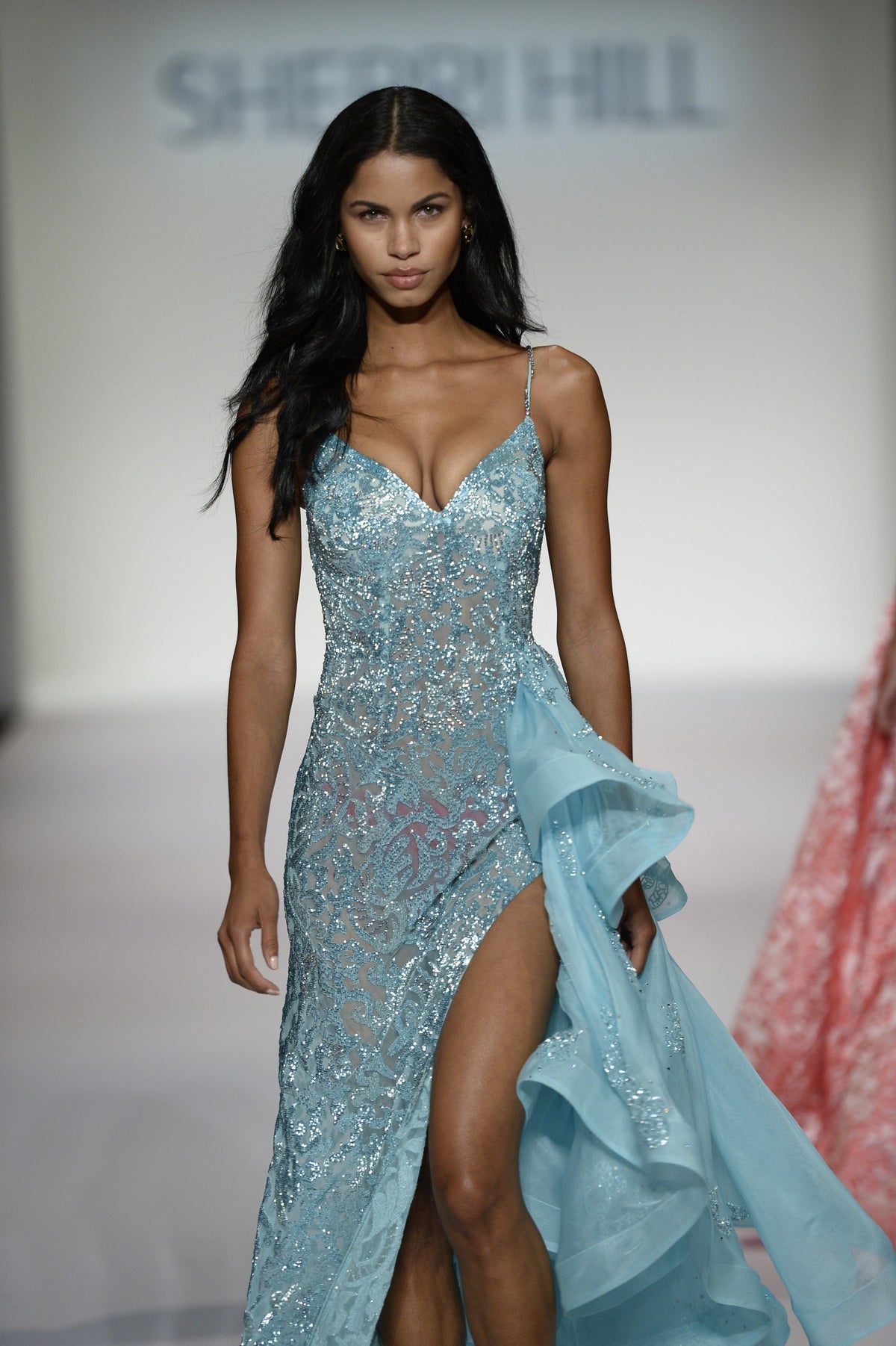 Sherri Hill 44825 beaded fitted gown with ruffled overskirt and slit