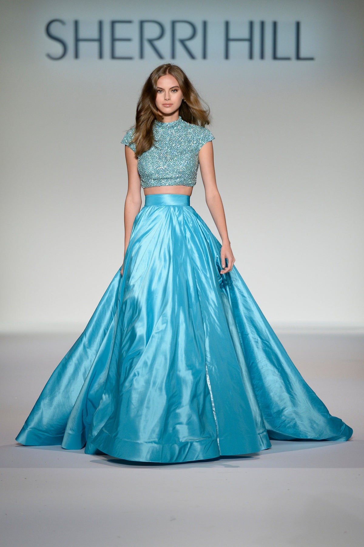Sherri Hill 44886 two-piece satin ball gown with beaded crop top in aqua