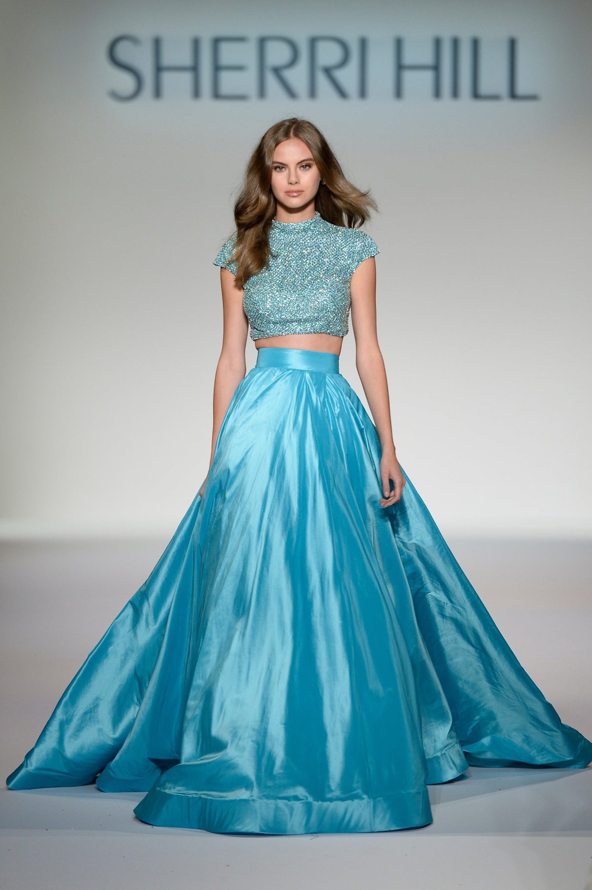 Sherri Hill 44886 two-piece satin ball gown with beaded crop top in aqua