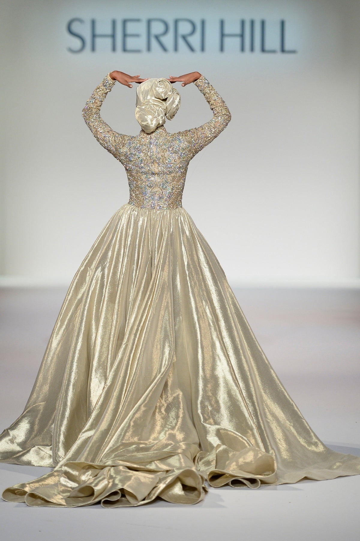 Sherri Hill 44895 long-sleeve metallic ball gown in gold