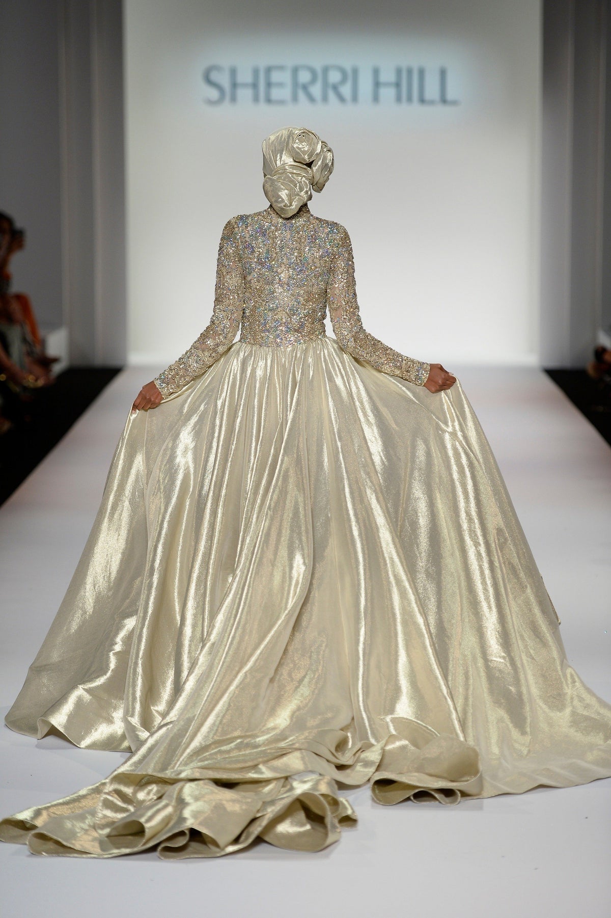 Sherri Hill 44895 long-sleeve metallic ball gown in gold