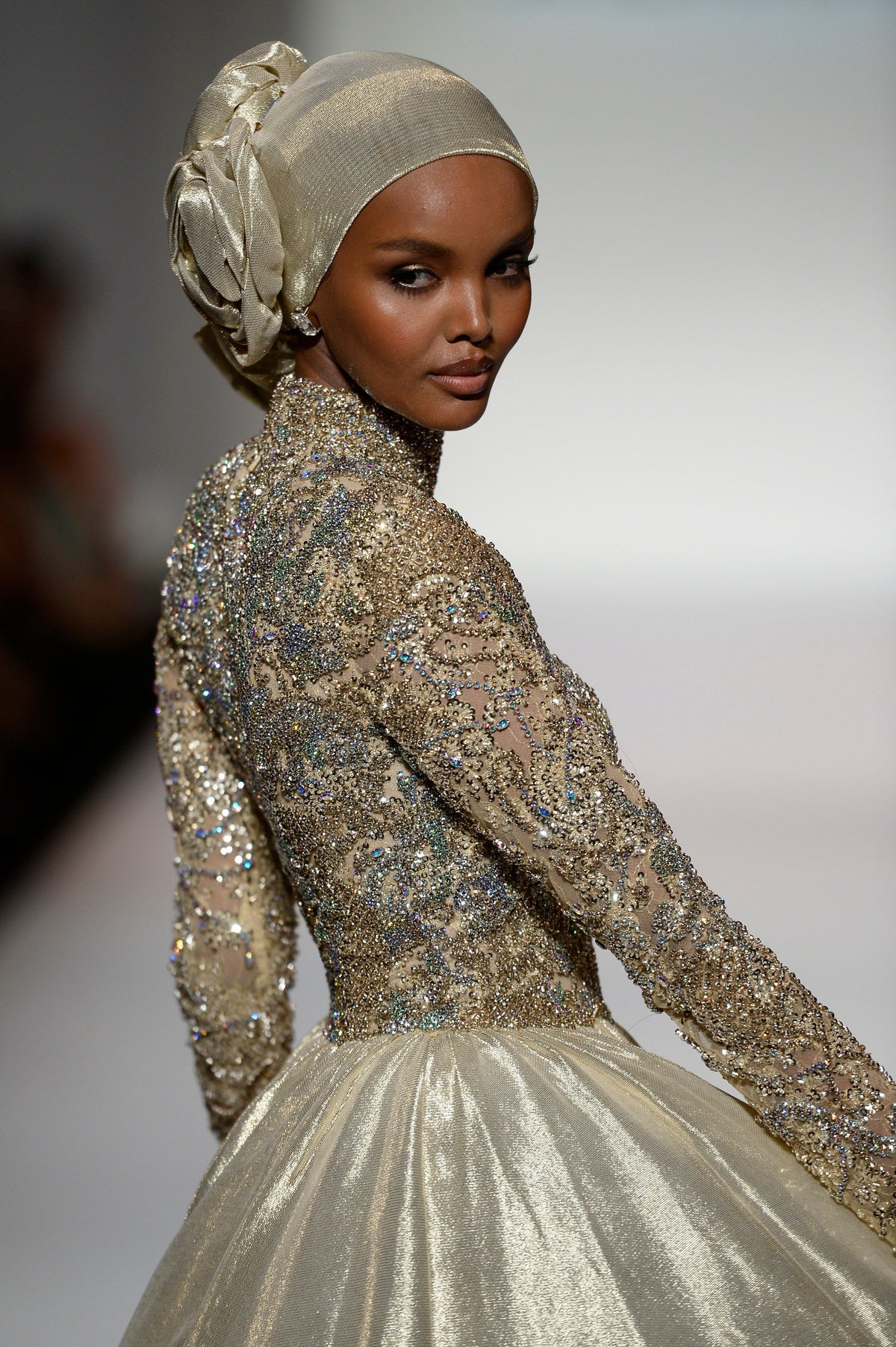 Sherri Hill 44895 long-sleeve metallic ball gown in gold