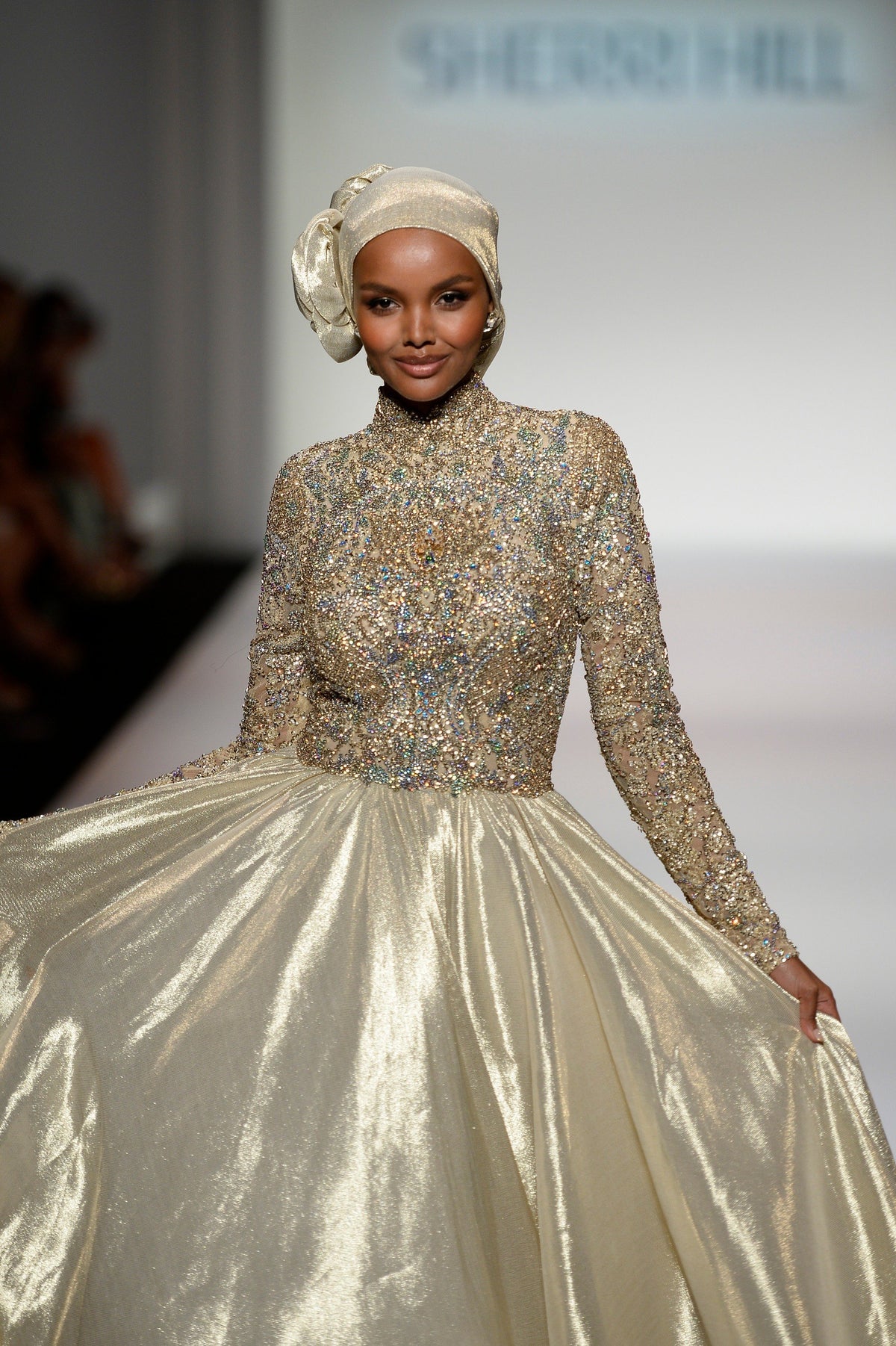 Sherri Hill 44895 long-sleeve metallic ball gown in gold