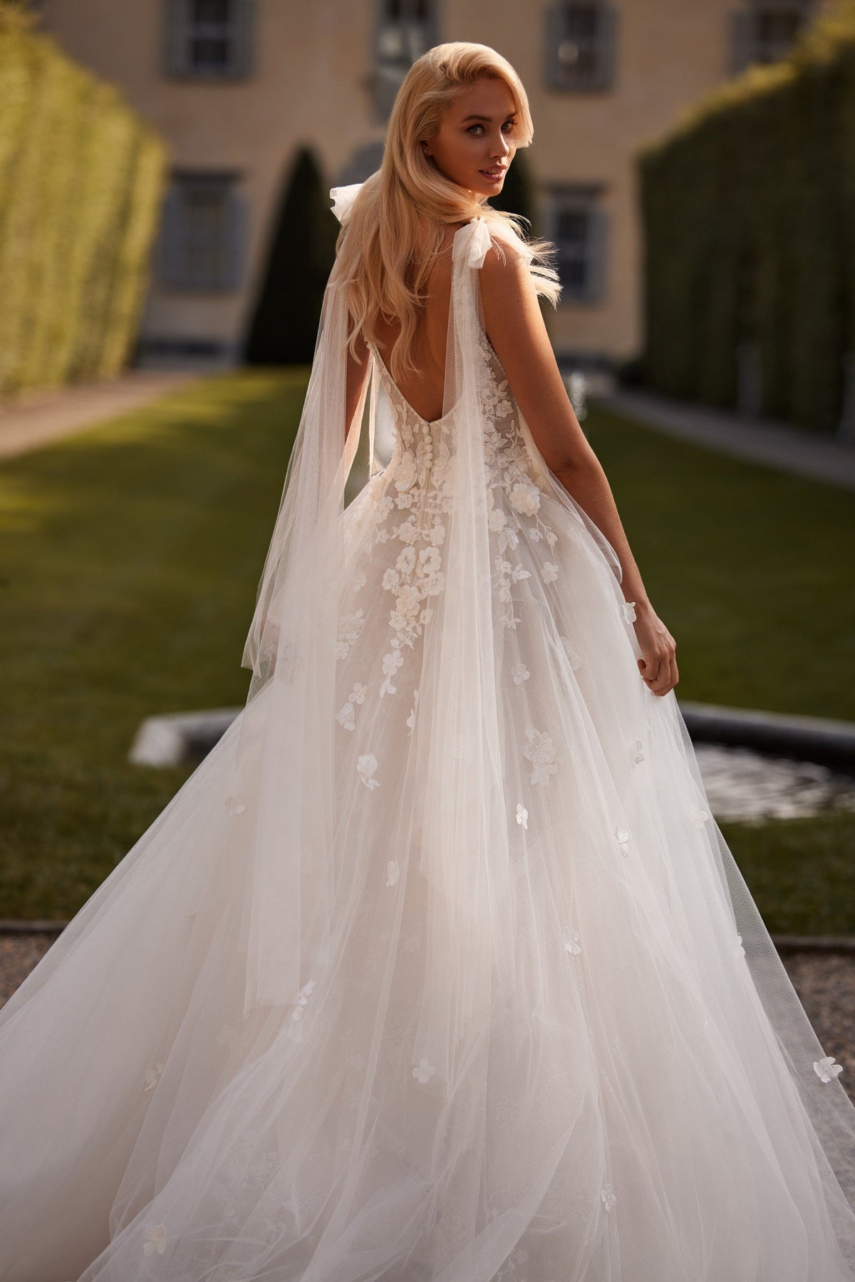 Sherri Hill 81139 V-neck floral appliquéd wedding dress with cape in ivory