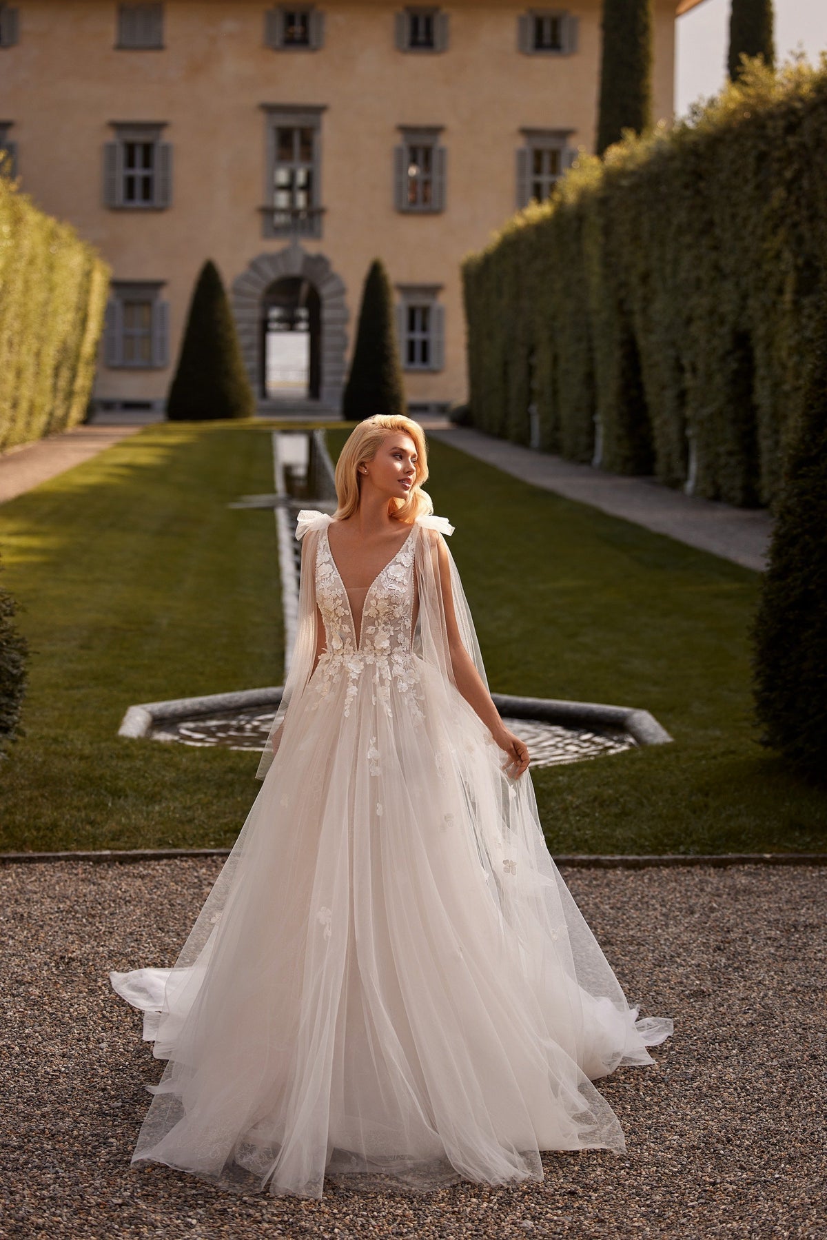 Sherri Hill 81139 V-neck floral appliquéd wedding dress with cape in ivory