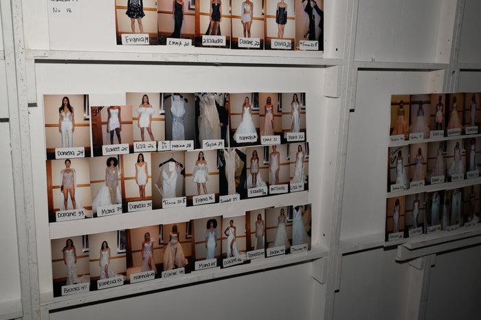 The look board backstage, every look pinned in show order