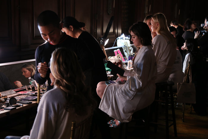 Hair and makeup underway backstage