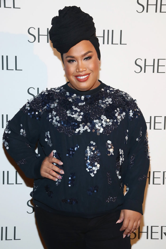 Patrick Starrr on the step-and-repeat before the show