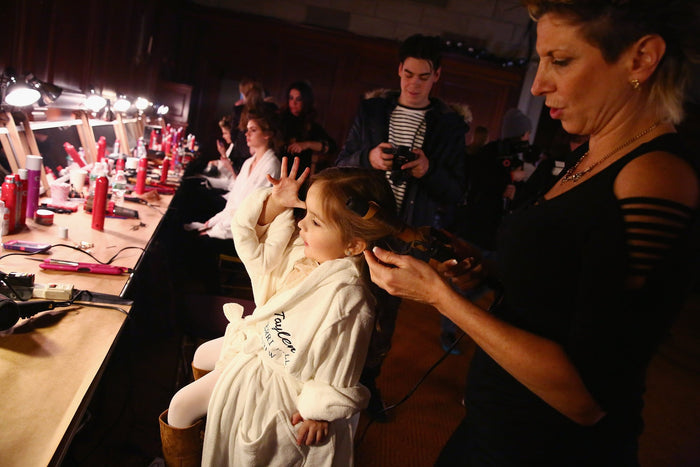 Hair and makeup underway backstage at Gotham Hall