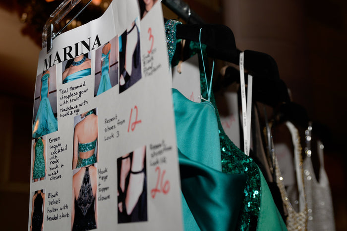 The run of show: look cards and gowns on the rack backstage