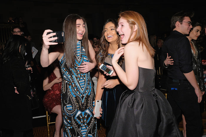 Guests take a selfie in the front row