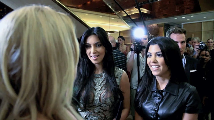 Kim Kardashian and Kourtney Kardashian at the Sherri Hill Spring 2012 show