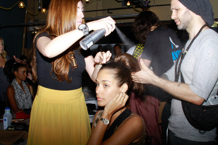 Hair being finished backstage before the show