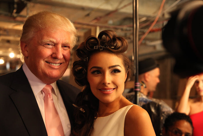 Olivia Culpo poses with Donald Trump backstage