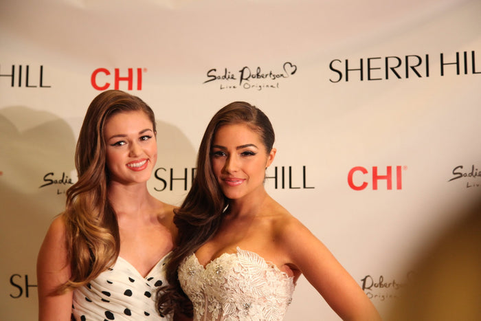 Sadie Robertson and Olivia Culpo pose on the red carpet