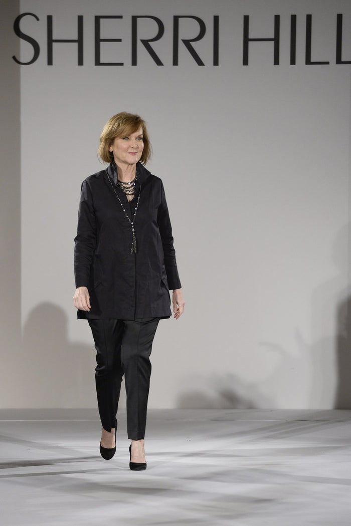 Sherri Hill walks the runway to close the show