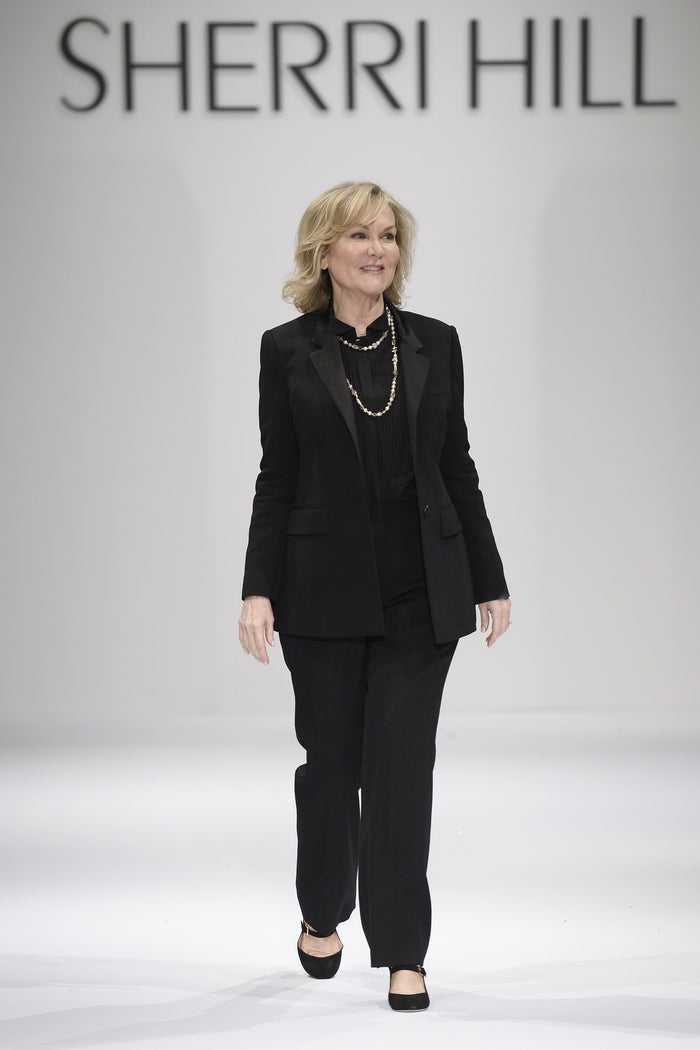 Sherri Hill walks the runway to close the show
