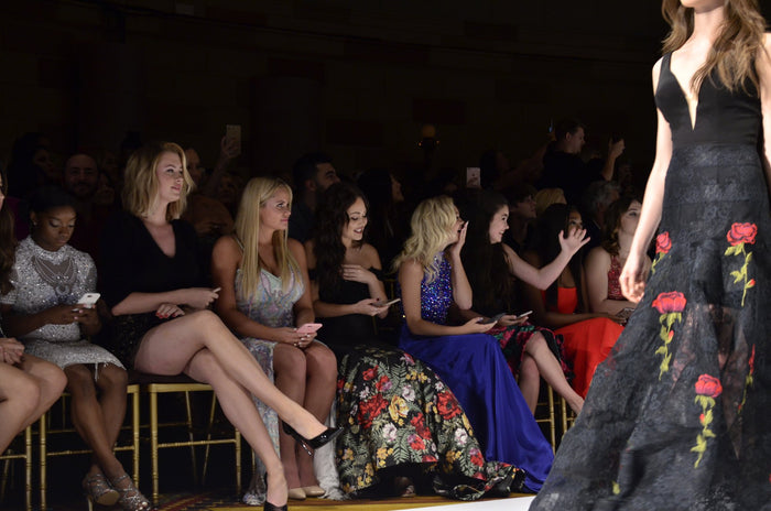 The black lace rose gown passes the front row