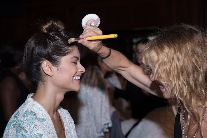 Model Lini Kennedy has her makeup finished backstage