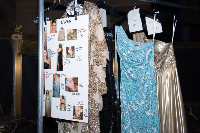The run of show: look cards and gowns on the rack backstage
