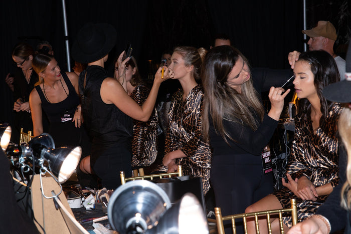 Hair and makeup underway backstage