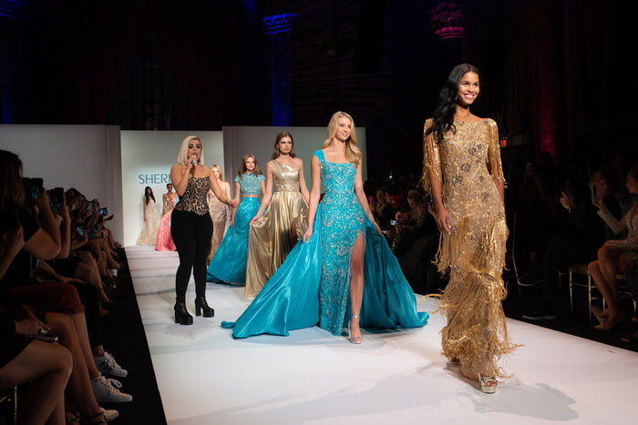 The finale lineup comes down the runway