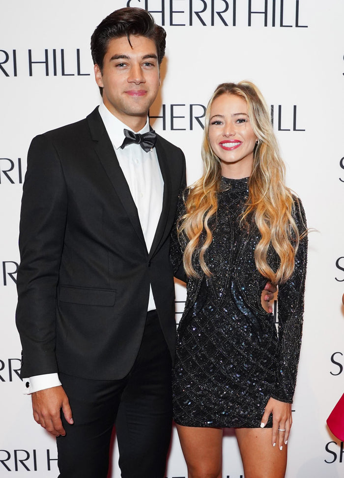 Two guests on the red carpet before the show